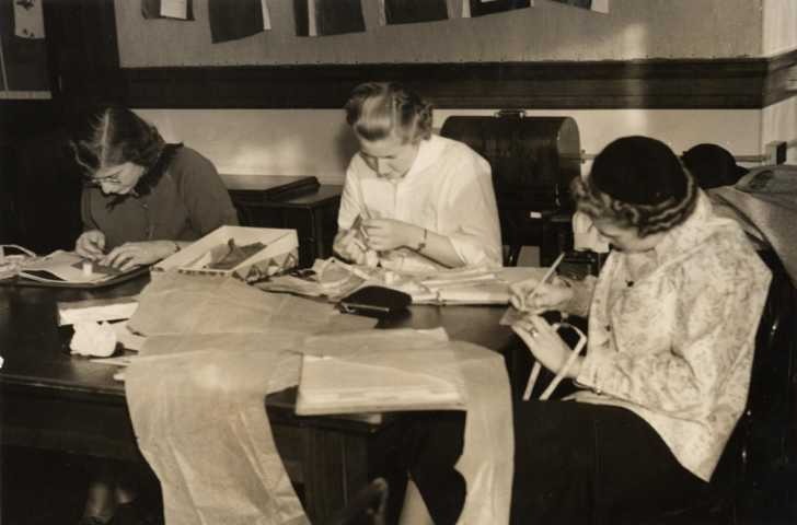 College girls at Oregon State University practicing their sewing skills. Via/ Flickr
