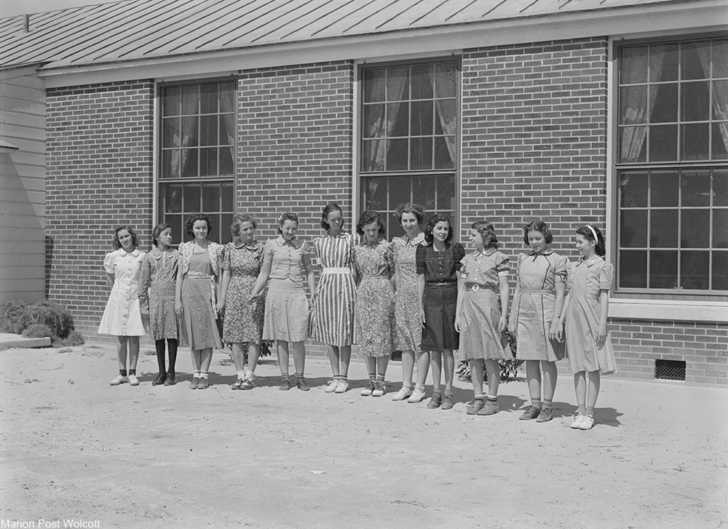 Girls showcasing the dresses they made in home ec class. Via/ Library of Congress